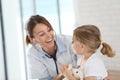 Young doctor examining little girl with stethoscope Royalty Free Stock Photo