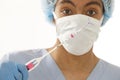 Young doctor holding an IUD birth control copper coil device in his hand