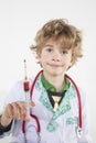 Young doctor holds a syringe in his hand filled with vaccine