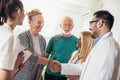 Young doctor during home visit senior people Royalty Free Stock Photo