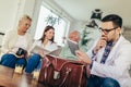 Young doctor during home visit senior people Royalty Free Stock Photo