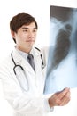 Young doctor looking at x-ray film Royalty Free Stock Photo