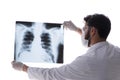 The young doctor looking at x-ray images isolated on white Royalty Free Stock Photo