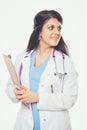 Young doctor or medic with clipboard and stethoscope standing on white background Royalty Free Stock Photo