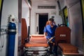 Young doctor in medical uniform sitting in the ambulance car Royalty Free Stock Photo