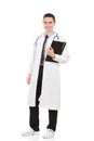 Young doctor posing with a clipboard Royalty Free Stock Photo