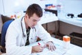 Young doctor prescribing recipe Royalty Free Stock Photo