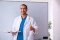 Young male doctor in presentation concept Royalty Free Stock Photo