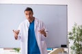 Young male doctor in presentation concept Royalty Free Stock Photo