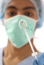 Young doctor ready to use an IUD birth control copper coil device in hand Royalty Free Stock Photo