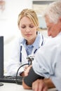 Young doctor with senior patient Royalty Free Stock Photo