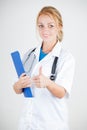 Young doctor with stethoscope giving thumbs up