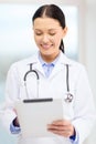 Young doctor with tablet pc and sthethoscope Royalty Free Stock Photo