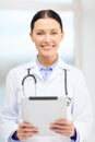 Young doctor with tablet pc and sthethoscope Royalty Free Stock Photo