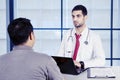 Young doctor talking with his patients Royalty Free Stock Photo