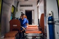 Young doctor in a uniform sitting in the ambulance car Royalty Free Stock Photo