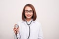 Young doctor woman holding stethoscope isolated on white background Royalty Free Stock Photo