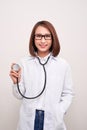 Young doctor woman holding stethoscope isolated on white background Royalty Free Stock Photo