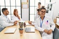 Young doctor woman smiling happy and looking to the camera during medicine meeting at the clinic office Royalty Free Stock Photo