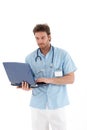 Young doctor working on laptop Royalty Free Stock Photo