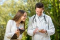 Young doctor with young and pretty assistant Royalty Free Stock Photo