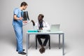 Young doctors discussing diagnosis in bright office. Two doctors disscusing xray at office table isolated on white background Royalty Free Stock Photo