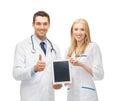 Young doctors holding tablet pc in hands