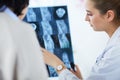 Young doctors studying X-ray images in clinic Royalty Free Stock Photo