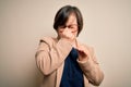 Young down syndrome business woman wearing glasses standing over isolated background tired rubbing nose and eyes feeling fatigue Royalty Free Stock Photo