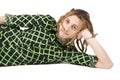 Young dreadlock man lies isolated Royalty Free Stock Photo