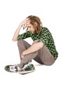 Young dreadlock man sits isolated Royalty Free Stock Photo