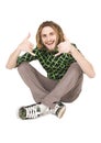 Young dreadlock man sits isolated Royalty Free Stock Photo