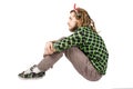 Young dreadlock man sits isolated