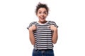 young dreamy well-groomed curly woman with black hair in a summer striped t-shirt