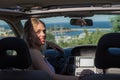 Young driver woman behind steering wheel Royalty Free Stock Photo