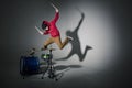 Young drummer jumping while playing