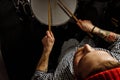 Young drummer rehearsing on drums before rock concert Royalty Free Stock Photo