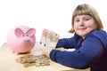 Young dutch girl showing euro money and piggy bank Royalty Free Stock Photo