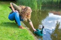 Young european woman filling caster with water