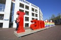 Young dutch woman with the letters I Amsterdam in the Netherlands