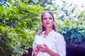 Young East Indian American Woman texting on cell phone outdoor at Central Park, New York Royalty Free Stock Photo