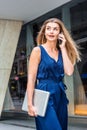 Young Eastern European American Woman talking on cell phone, traveling, working in New York City Royalty Free Stock Photo