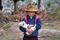 Young ecuadorian girl with dog near Quilotoa, Ecuador