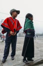 Young Ecuadorian indigenous schoolboy and schoolgirl pose for a picture at their schoolyard