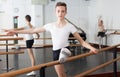 Young efficient dancer exercising in ballroom