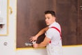 The young electrician working in a new building Royalty Free Stock Photo