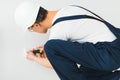 A young electrician installing an electrical socket in a new house Royalty Free Stock Photo