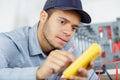 young electrician using multi meter Royalty Free Stock Photo