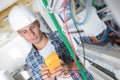 Young electrician using multimeter Royalty Free Stock Photo