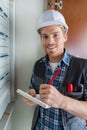 young electrician working on electric panel Royalty Free Stock Photo